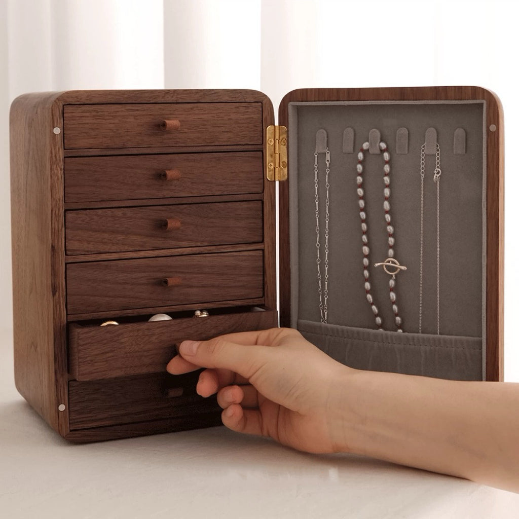 Elegant black walnut jewelry box with ornate front panel