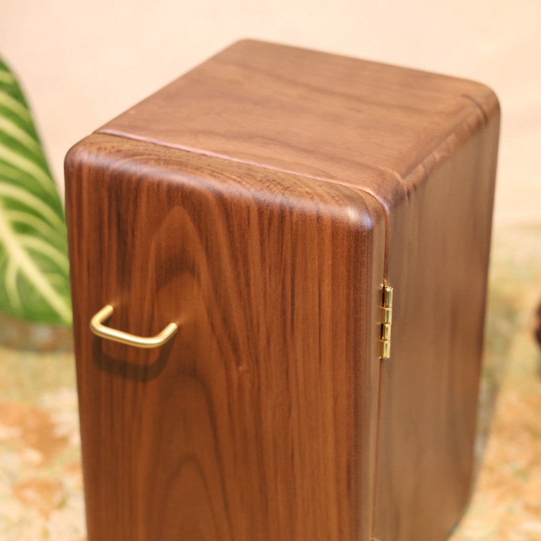 Wooden box with a gold handle on a blurred background
