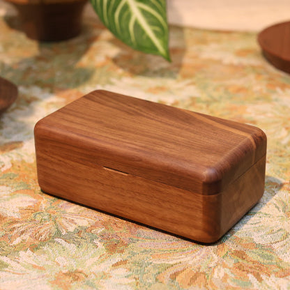Wooden box on a floral-patterned surface
