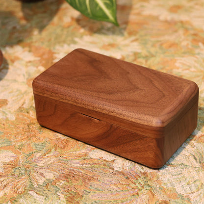 Wooden box on a patterned fabric surface