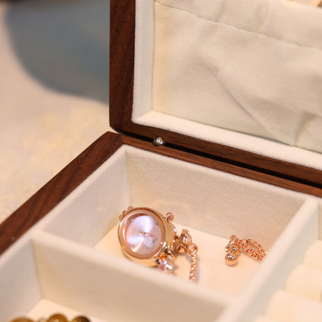 Jewelry box with a ring, necklace, and bracelet inside