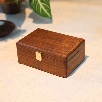 Wooden box with a lock on a textured surface