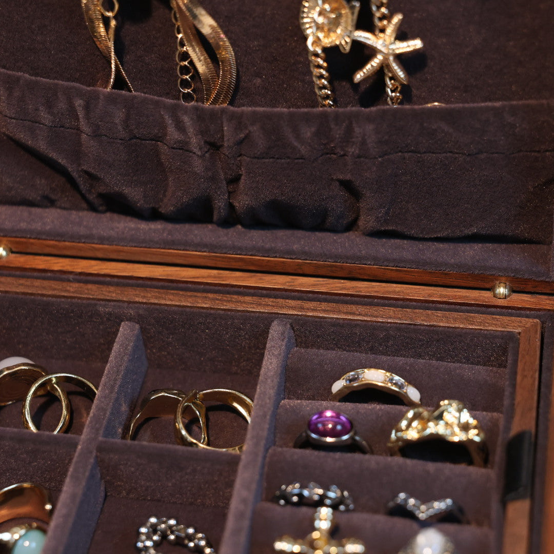 Jewelry box with various rings and earrings inside