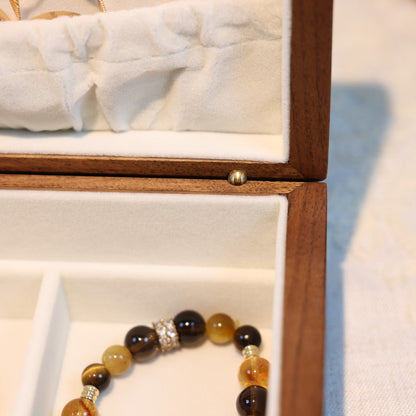 Jewelry box with a bracelet inside on a white surface