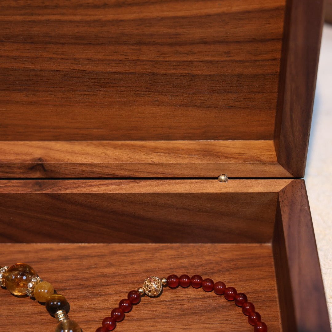 Wooden jewelry box with a bracelet inside