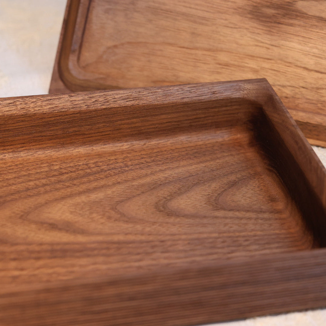 Wooden trays with a natural finish on a light background