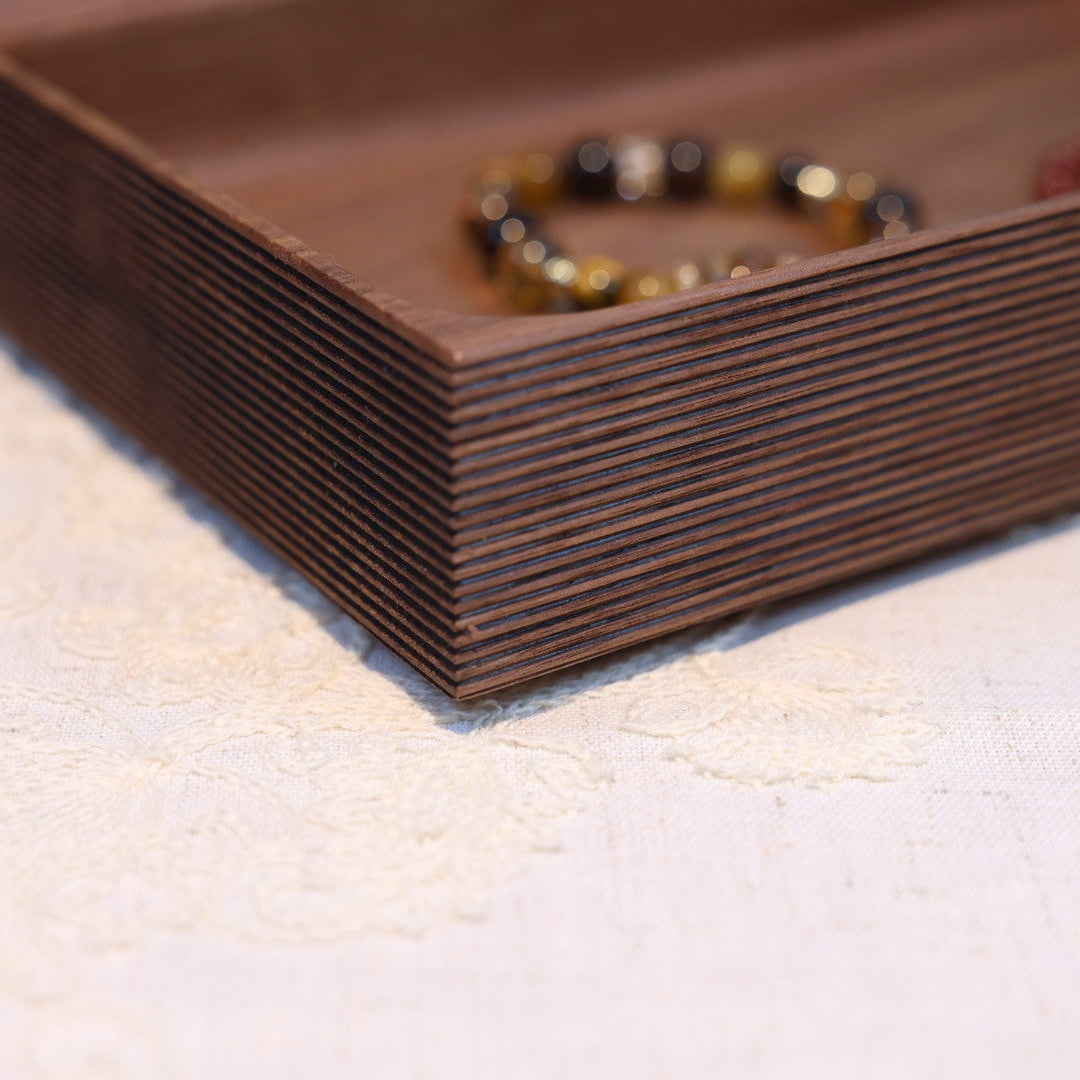 Bracelet on a wooden tray with a blurred background