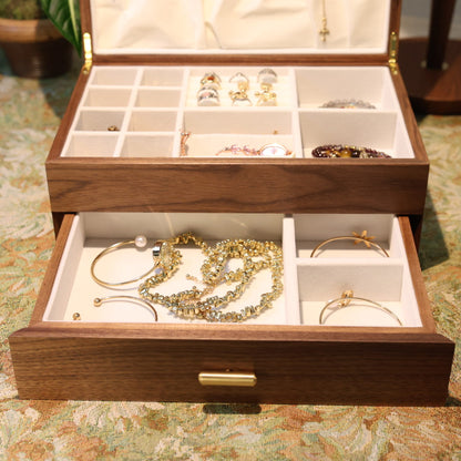 Wooden jewelry box with jewelry on a patterned surface