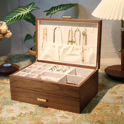 Wooden jewelry box with jewelry on a decorative table