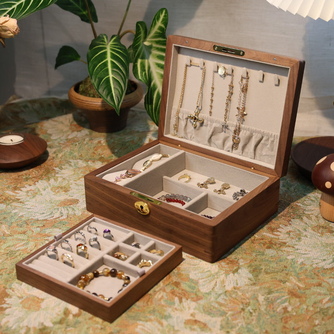 Wooden jewelry box with jewelry on a decorative table