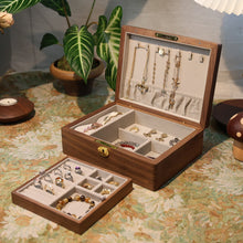 Wooden jewelry box with jewelry on a decorative table