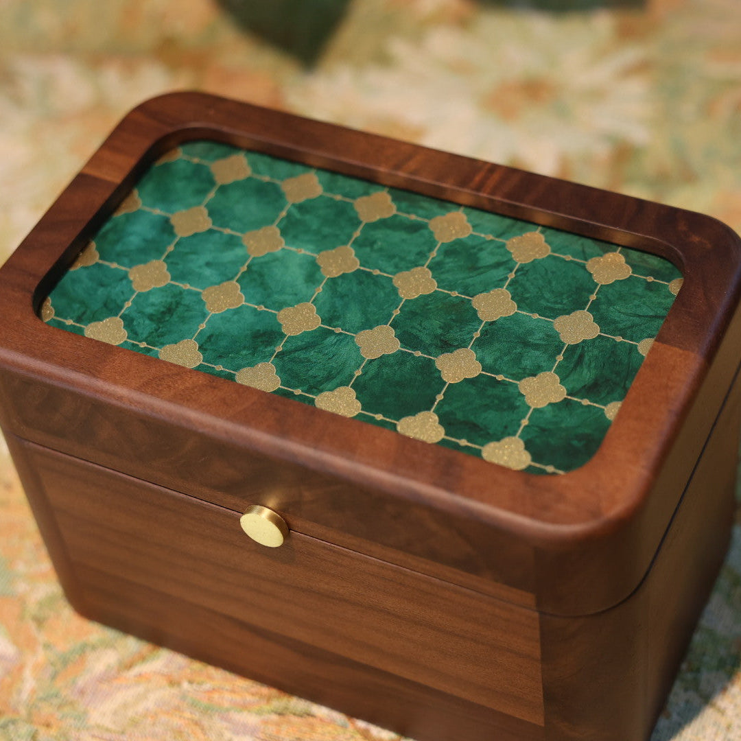 Wooden box with a green checkered lid on a textured surface