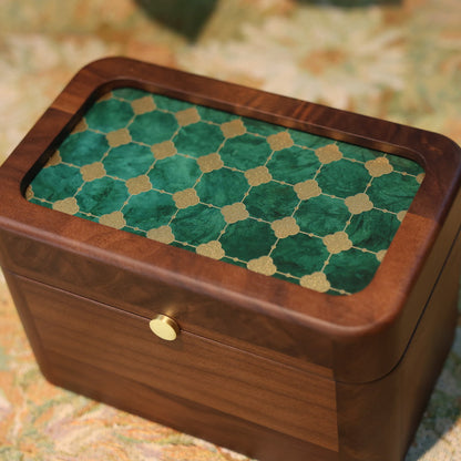 Wooden box with a green checkered lid on a textured surface