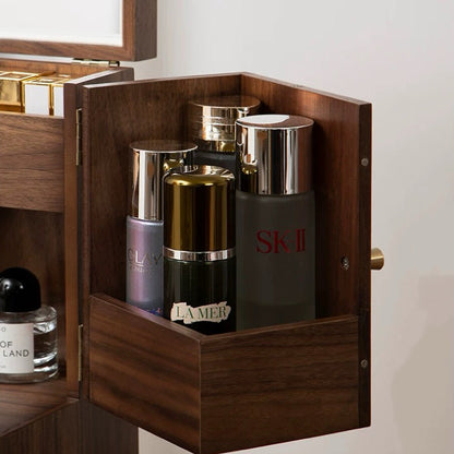 Wooden jewelry box with skincare products including SK-II and Olay.