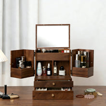 Wooden jewelry and makeup organizer with mirror and compartments on a wooden floor.