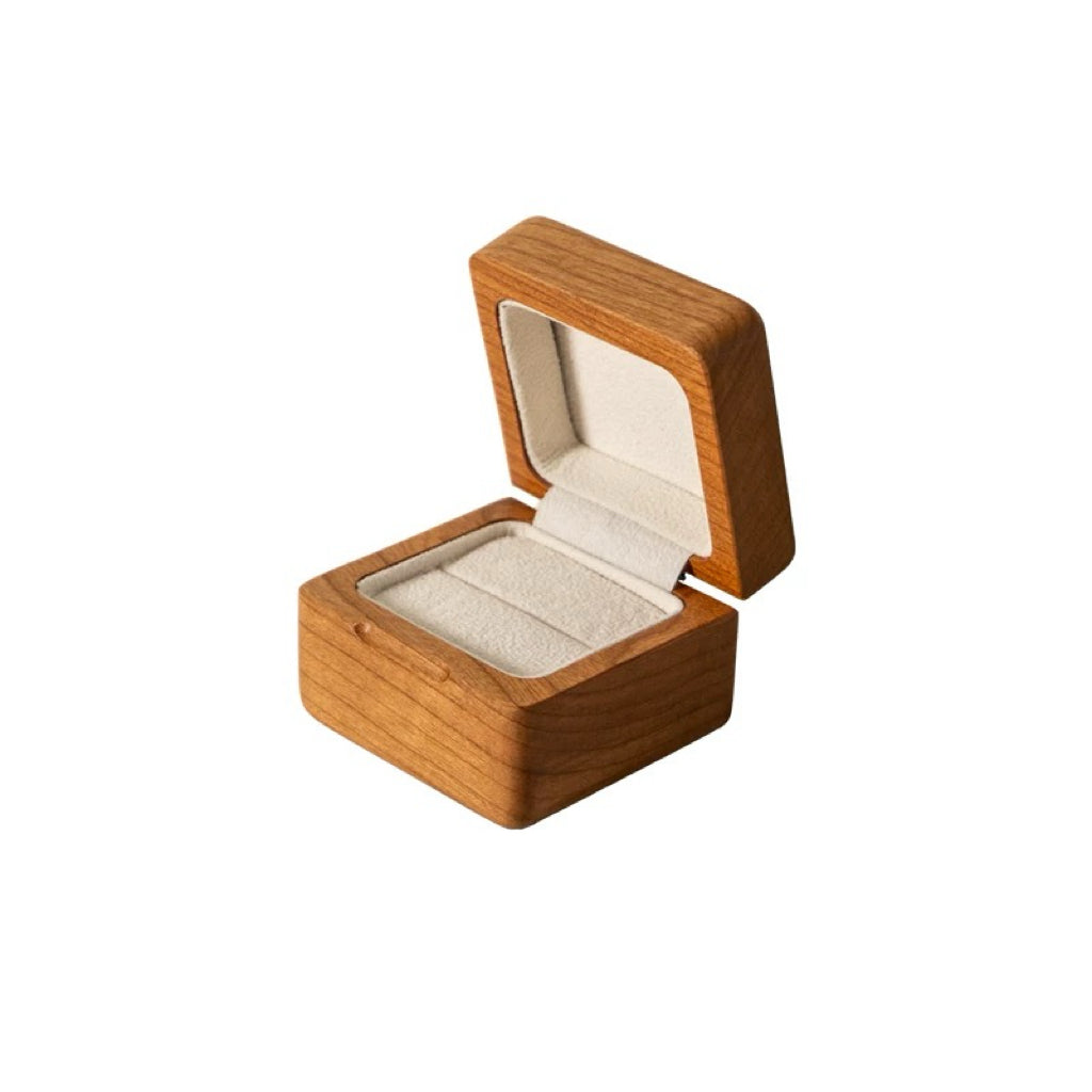 Ring presented inside natural solid wood box