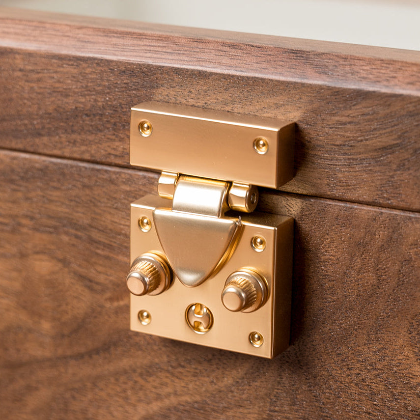 Single bangle resting inside minimalist walnut box